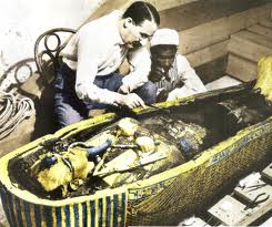 Howard Carter, examining  Tutankhamun's sarcophagus 