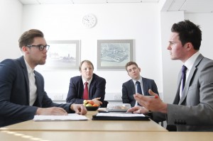 Shadow Minister Toby Perkins watches Portsmouth Business School students Dan and Ollie role-play a complex sales negotiation meeting using current best-practice methods